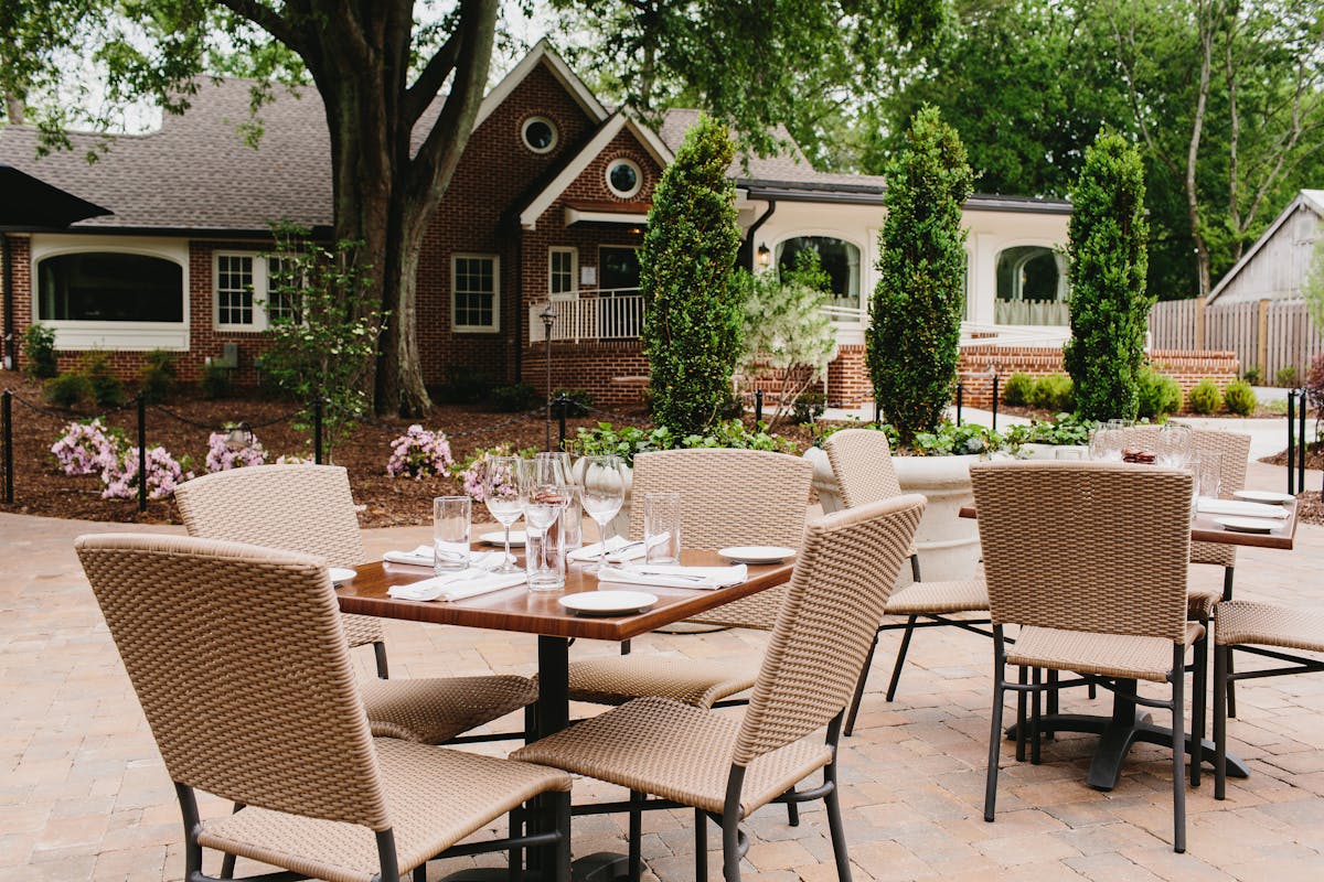 a group of lawn chairs sitting on top of a picnic table